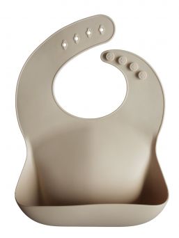Mushie silikoninen ruokalappu on klassinen ja ajaton. Helppo puhdistaa ja voit rullata sen mukaan matkalle.